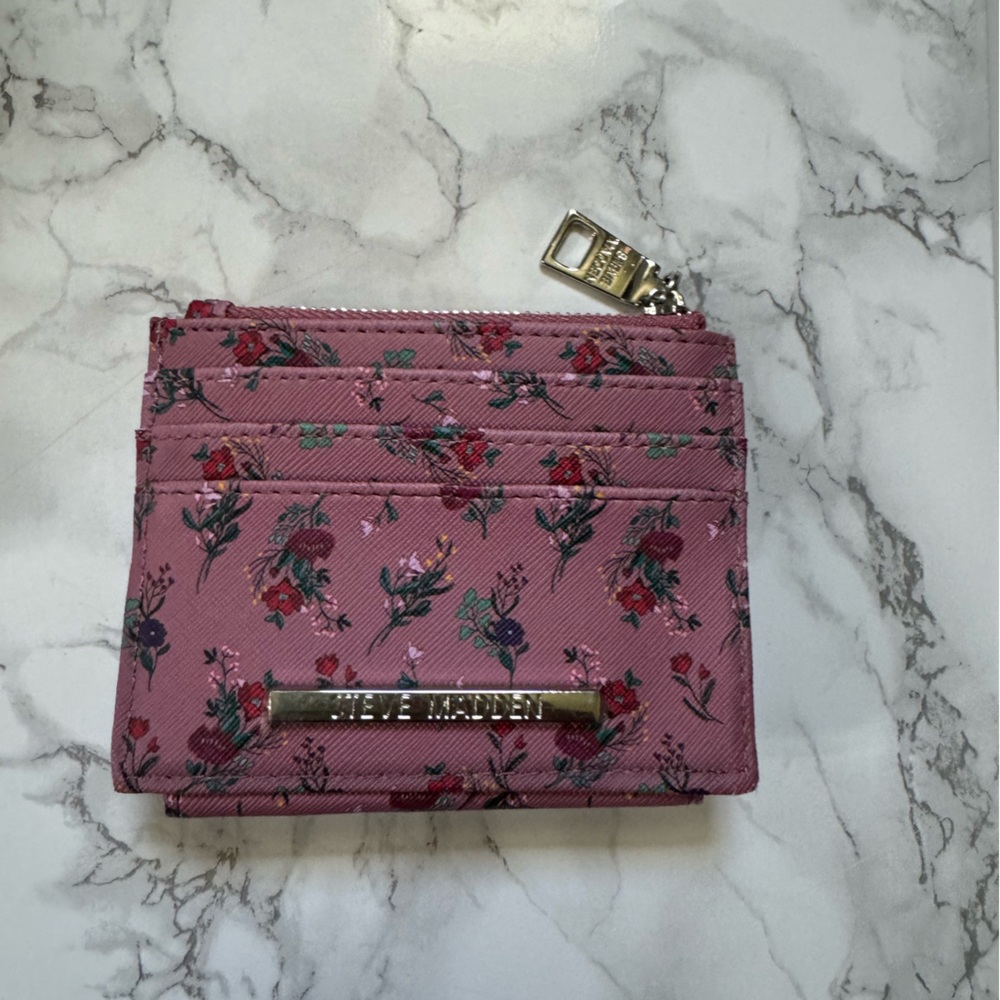 Steve Madden Y2K Pink Lily’s & Butterflies wallet. Good used condition.